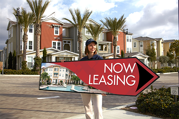 Woman with advertising sign in the shape of an arrow